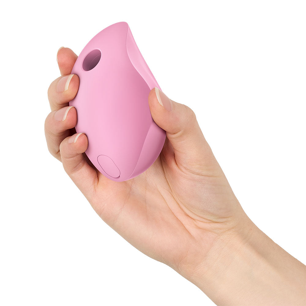 Fun Factory DELICIA Rose - Rose USB Rechargeable Air Pulse Stimulator held in a hand, showcasing its ergonomic design.