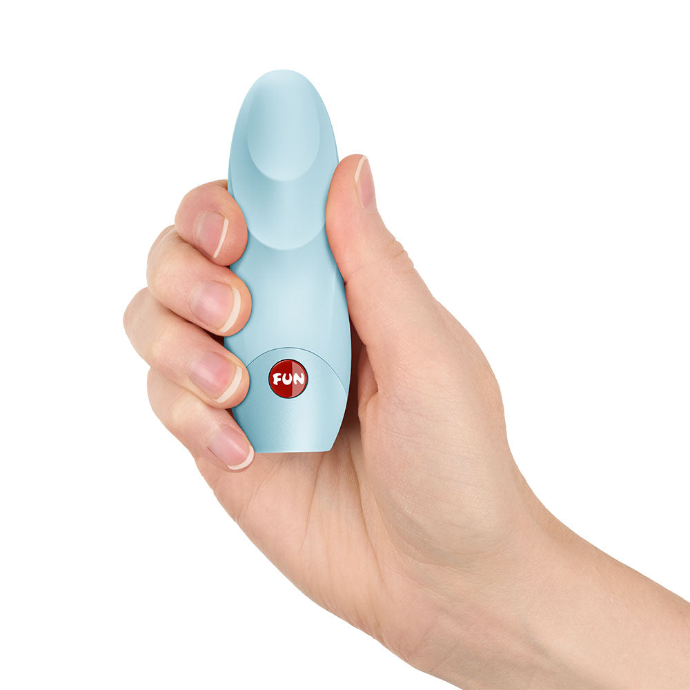 Hand holding the Fun Factory VIOLA Ice - Ice Vibrating Bullet, a sleek and compact pleasure device.
