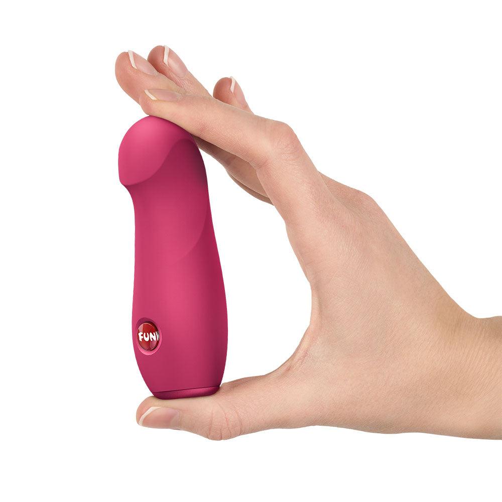 Fun Factory STELLA Raspberry - Raspberry Vibrating Bullet held in hand showcasing its design and compact size.