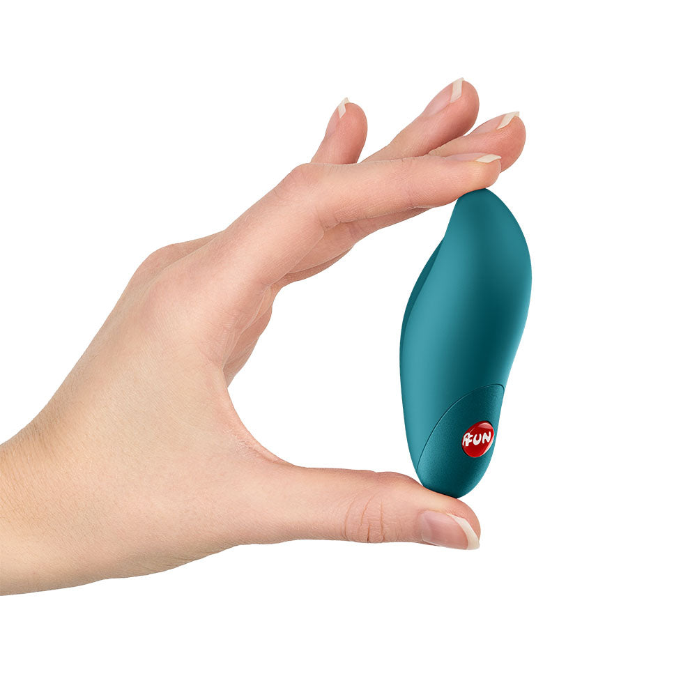 Fun Factory CHARME Bottle  - Bottle  USB-C Rechargeable Stimulator held in hand, showcasing its ergonomic design.