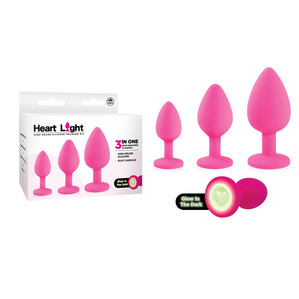 Heart Light -  -  Butt Plugs with Glow in Dark Bases - Set of 3 Sizes in pink silicone with glow-in-the-dark heart base