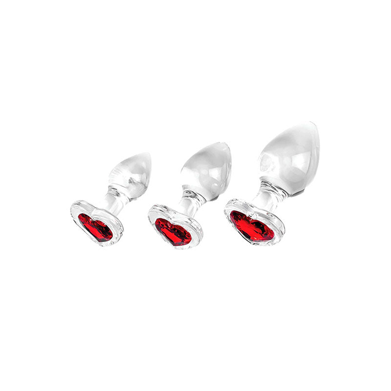 Adam & Eve RED HEART GEM GLASS PLUG SET -  Glass Butt Plugs - Set of 3 Sizes, featuring heart-shaped bases with red gems.