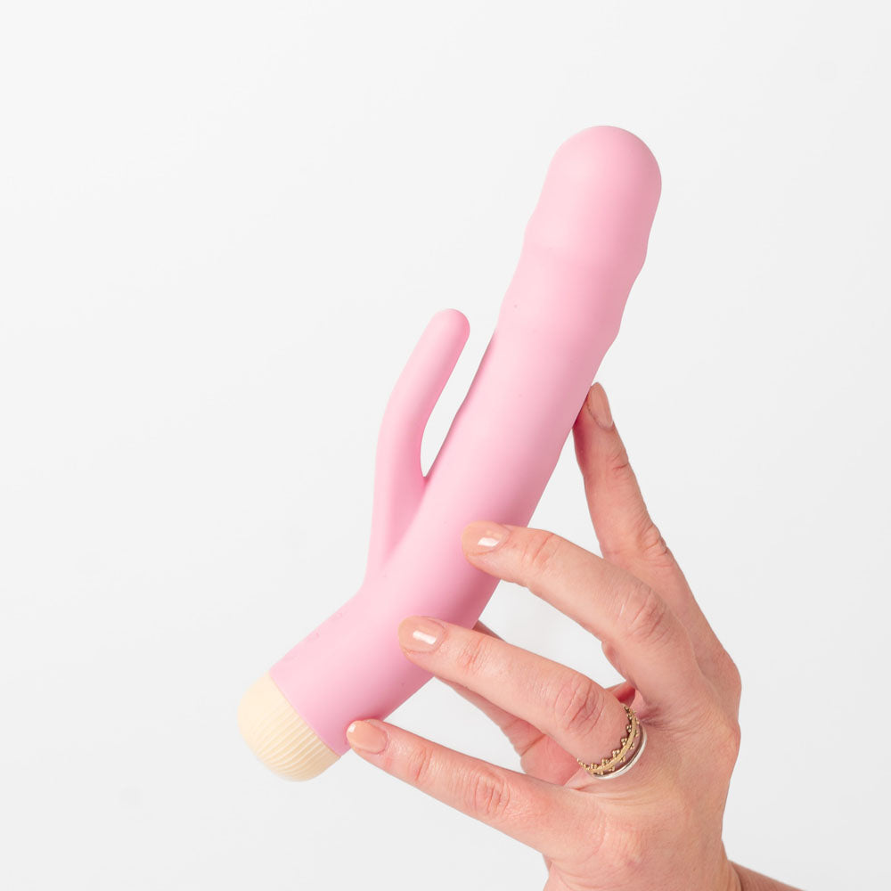Girls Get Off - DeeDee - 19 cm USB Rechargeable Thrusting Rabbit Vibrator held in hand, highlighting its sleek design and functionality.