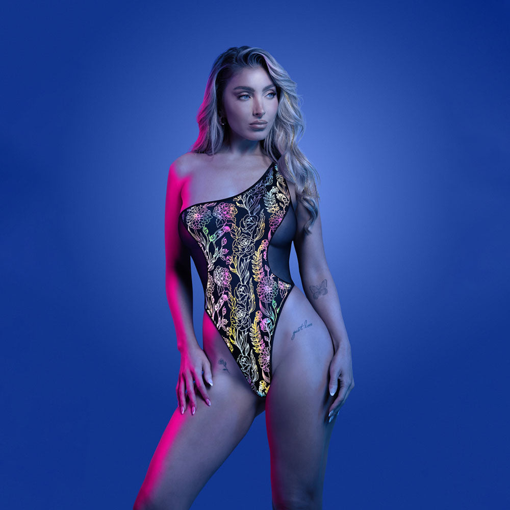 GLOW Luminescent Flash Teddy SM -  Reflective Teddy - S/M Size worn by a model in vibrant floral print against blue background.