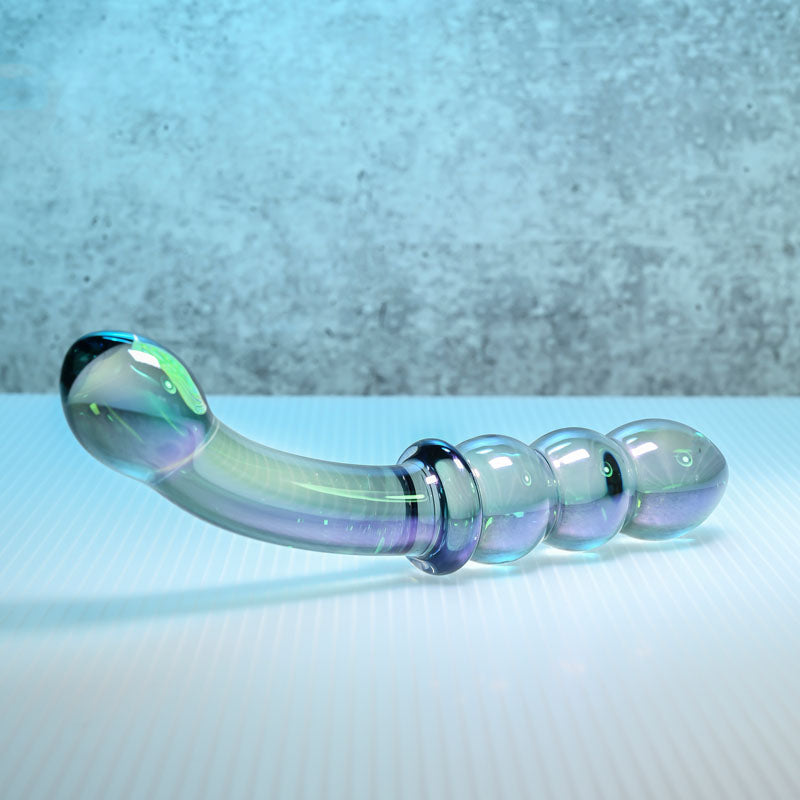Gender X LUSTROUS GALAXY WAND, violet glass double ended massager showcasing curved and beaded design.