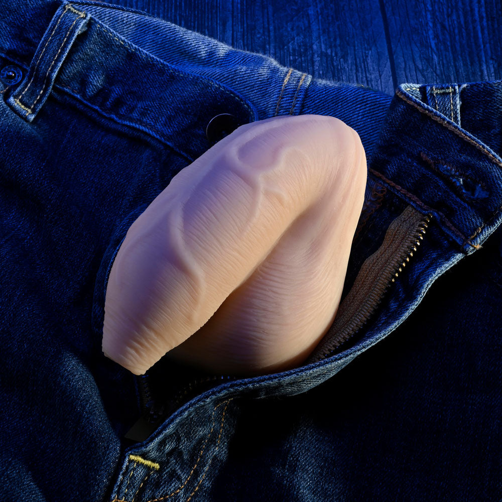 Gender X THE UNCIRCUMCISED PACKER - Light - 11.5 cm Packer tucked into jeans, realistic design and texture.