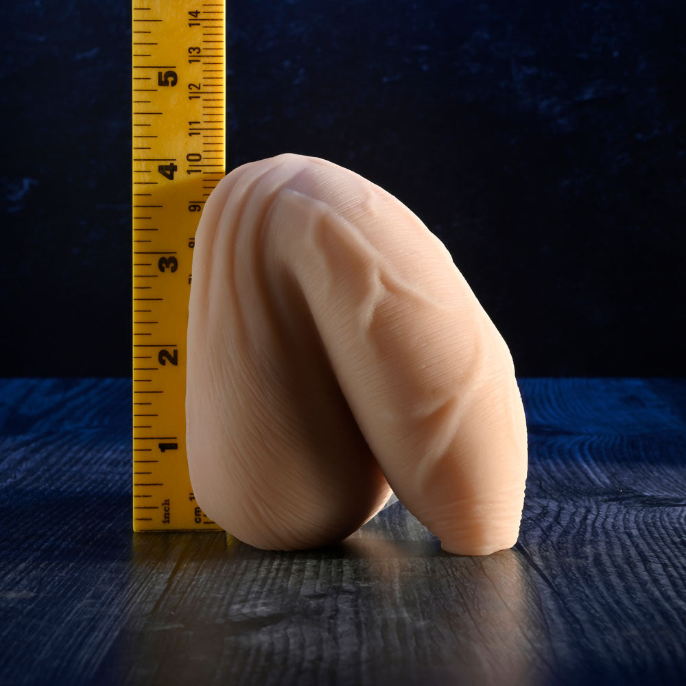 Gender X THE UNCIRCUMCISED PACKER - Light - 11.5 cm Packer displayed next to a ruler for size reference.