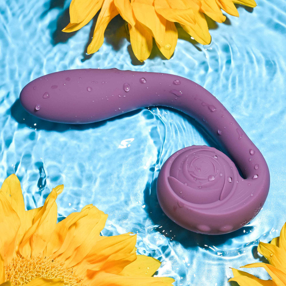Gender X POSEABLE YOU -  USB Rechargeable Poseable Vibrator in a pool surrounded by sunflowers.
