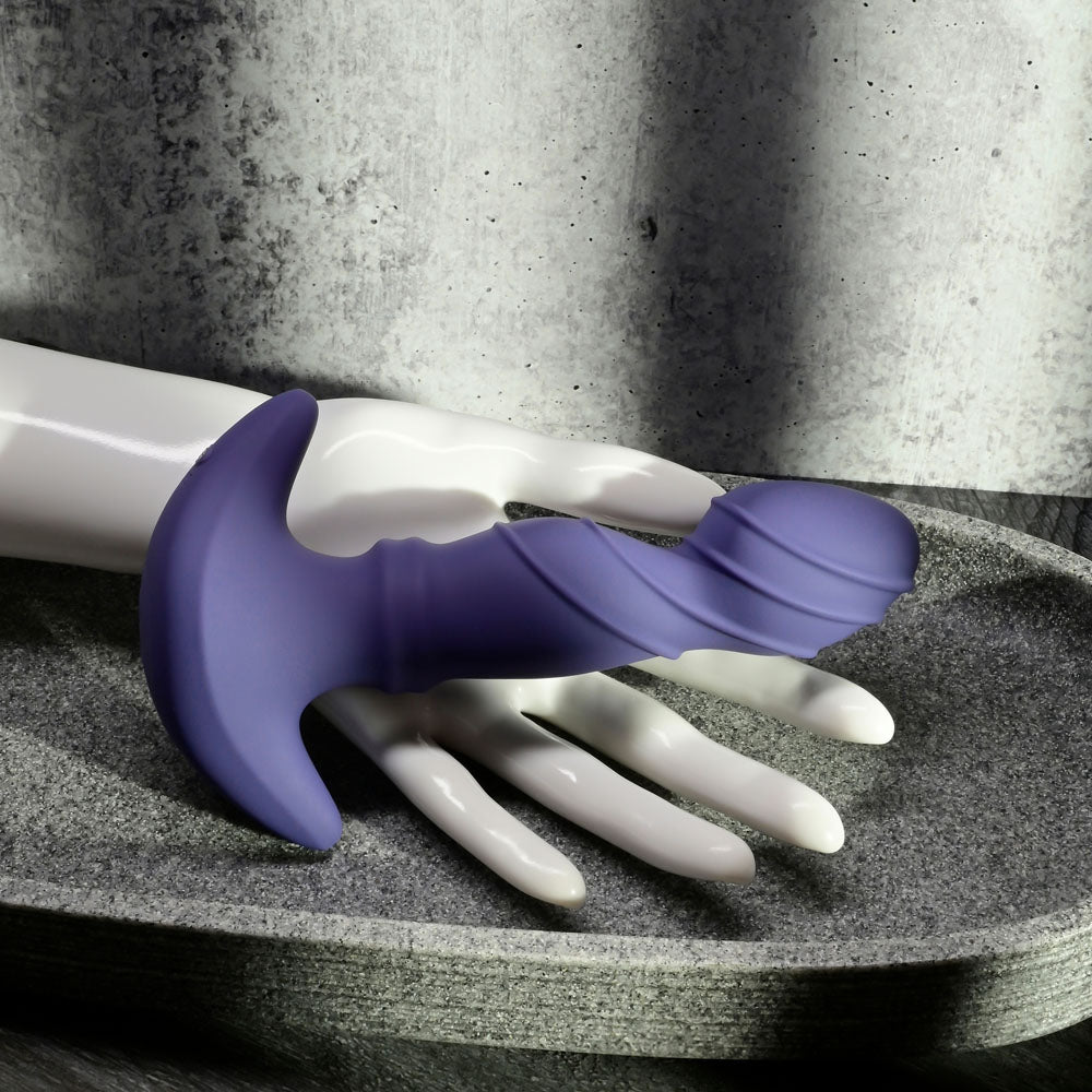Gender X RING IT -  16.5 cm USB Rechargeable Vibrator with Wireless Remote on a decorative tray.