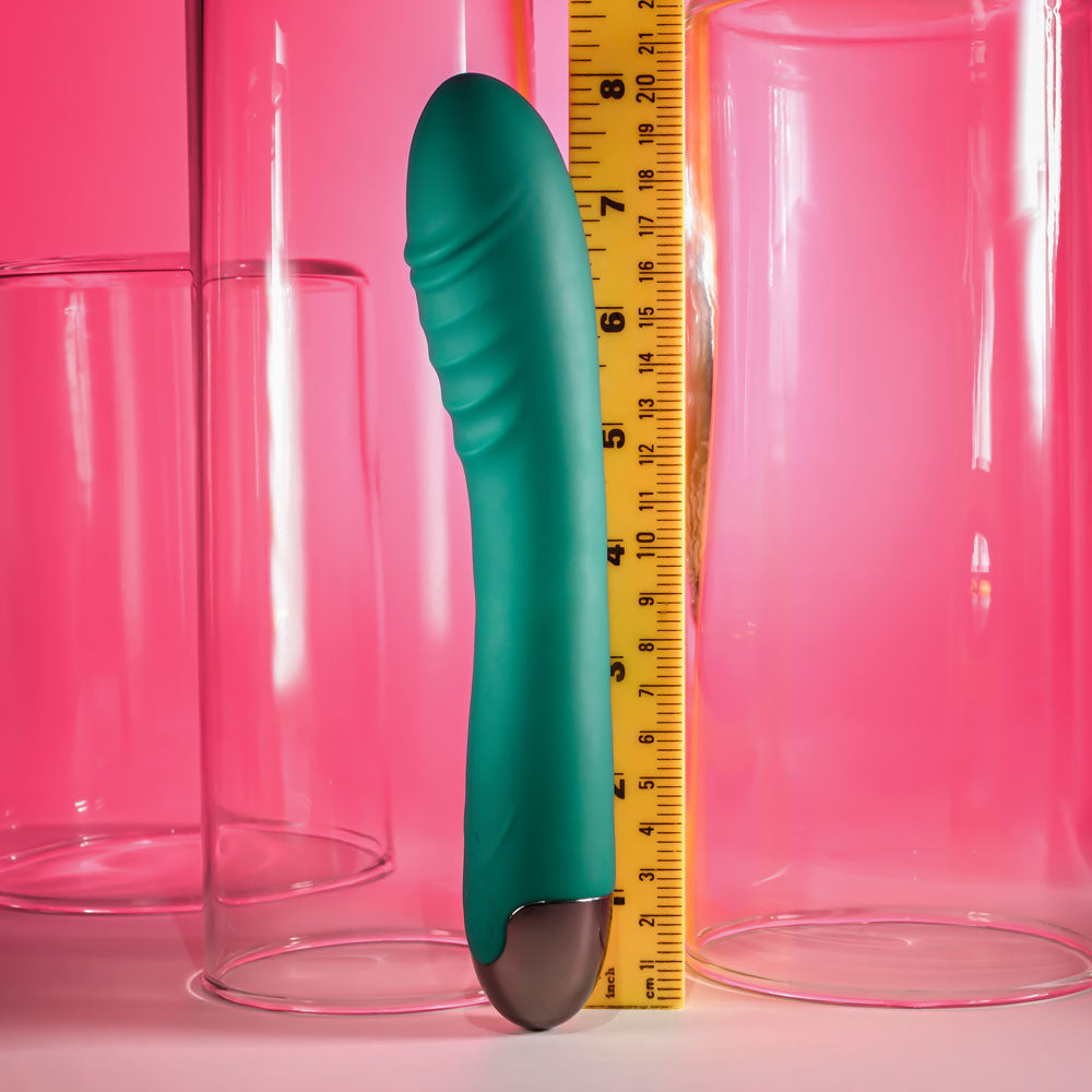 Gender X PIROUETTE -  20.6 cm USB Rechargeable Vibrator next to measuring tape for size reference.