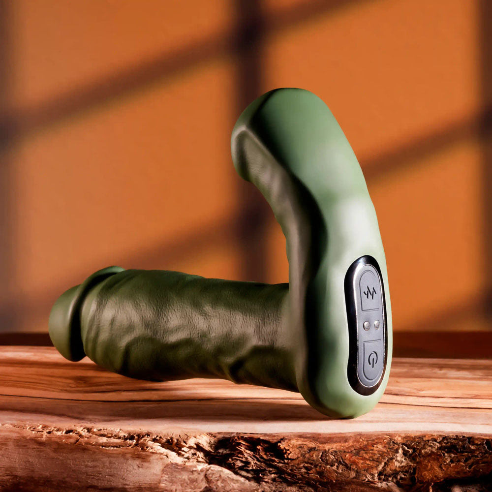 Gender X THE HUNK - 15.2 cm USB Rechargeable Thrusting Vibrator with Remote on a wooden surface.