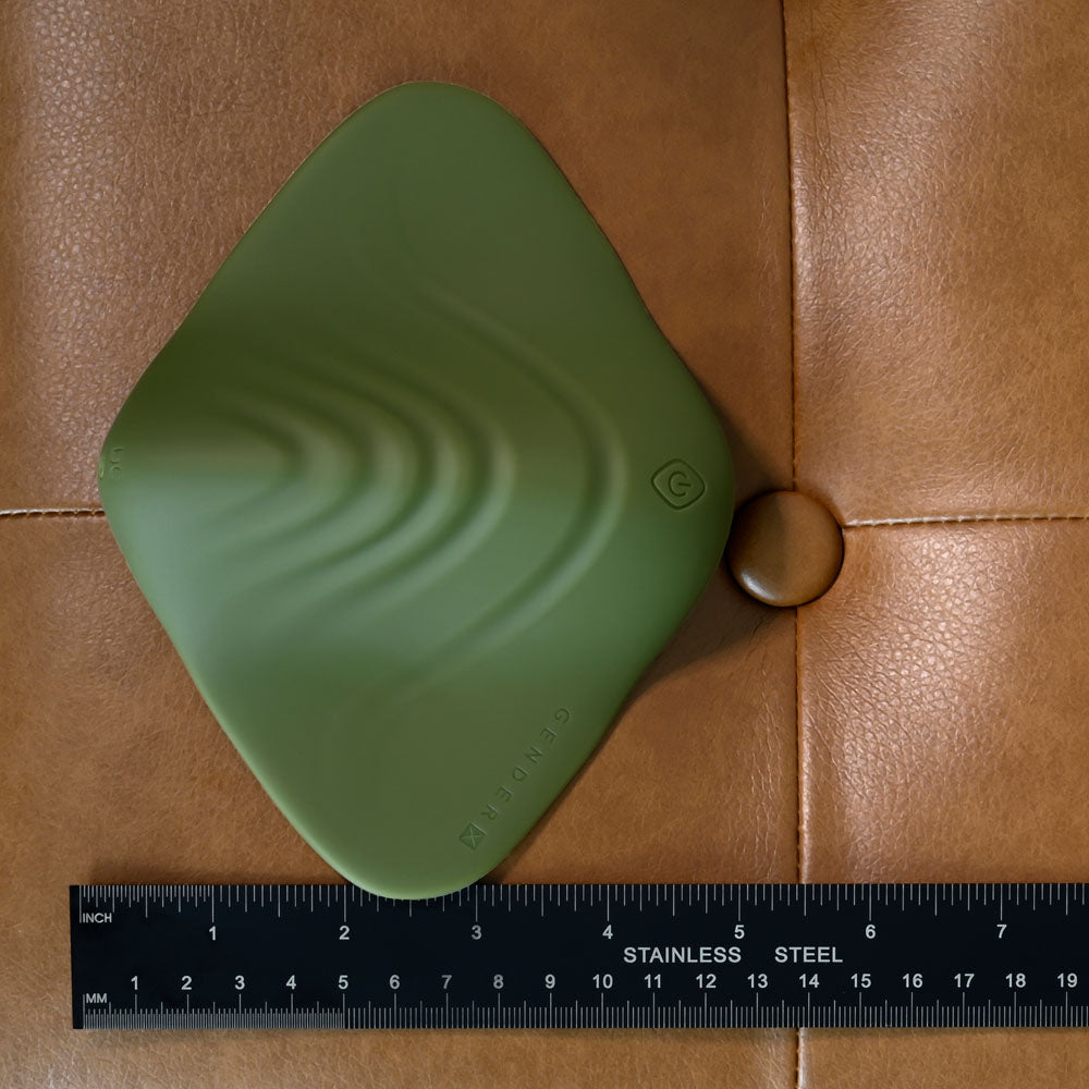 Gender X PLEASURE PAD -  USB Rechargeable Grinding Pad on a surface with a ruler for scale.