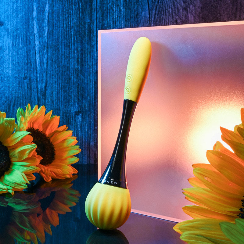 Gender X SUNFLOWER - 20 cm USB Rechargeable Massage Wand surrounded by sunflowers, showcasing its stylish design.