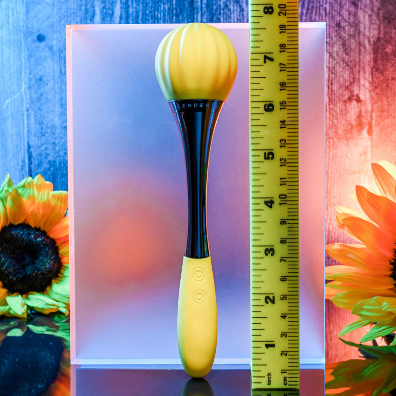 Gender X SUNFLOWER - 20 cm USB Rechargeable Massage Wand next to a measuring tape with sunflowers in the background.