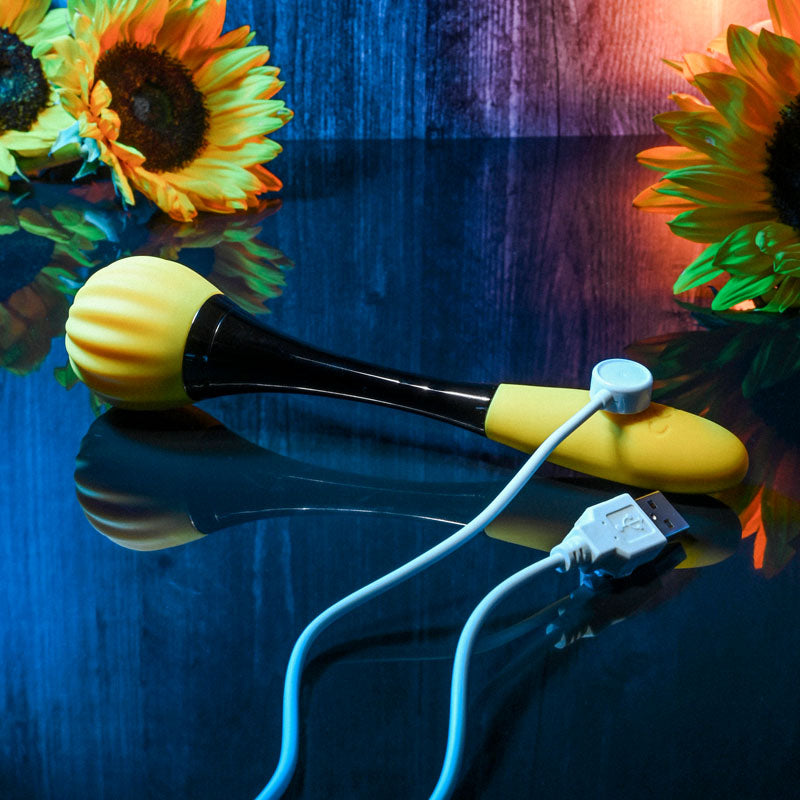 Gender X SUNFLOWER - 20 cm USB Rechargeable Massage Wand with USB cable and yellow textured head.