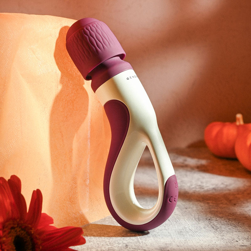 Gender X HANDLE IT - /White USB Rechargeable Massager Wand displayed among intimate decor.