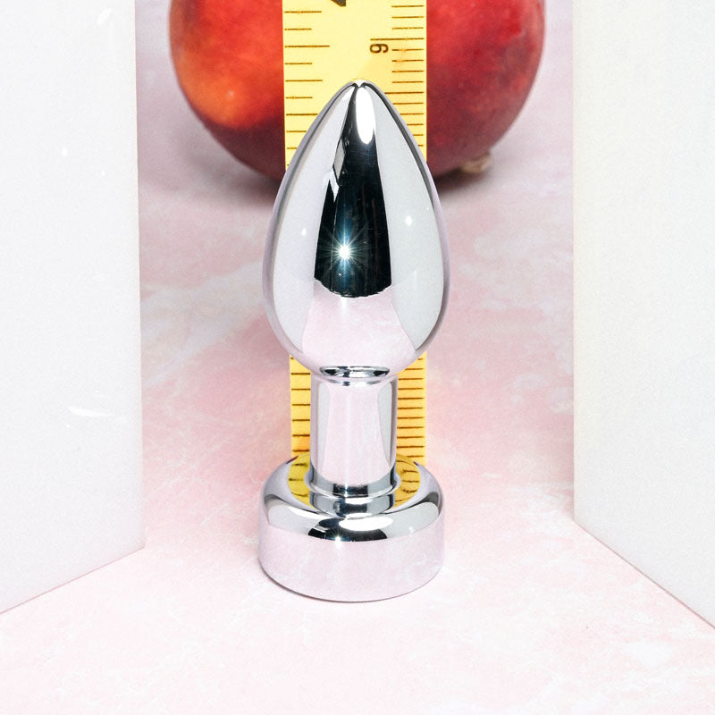Gender X ROCKIN' METAL PLUG - Metallic 9.3 cm USB Rechargeable Butt Plug displayed next to a ruler.
