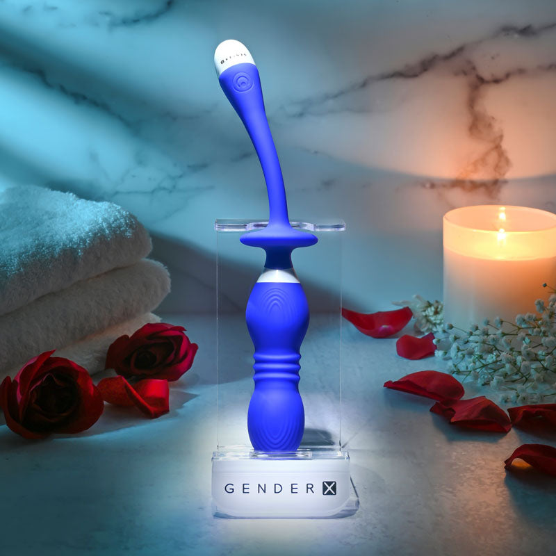 Gender X PLAY BALL -  25 cm USB Rechargeable Thrusting & Vibrating Orbs on display with flowers and candles.