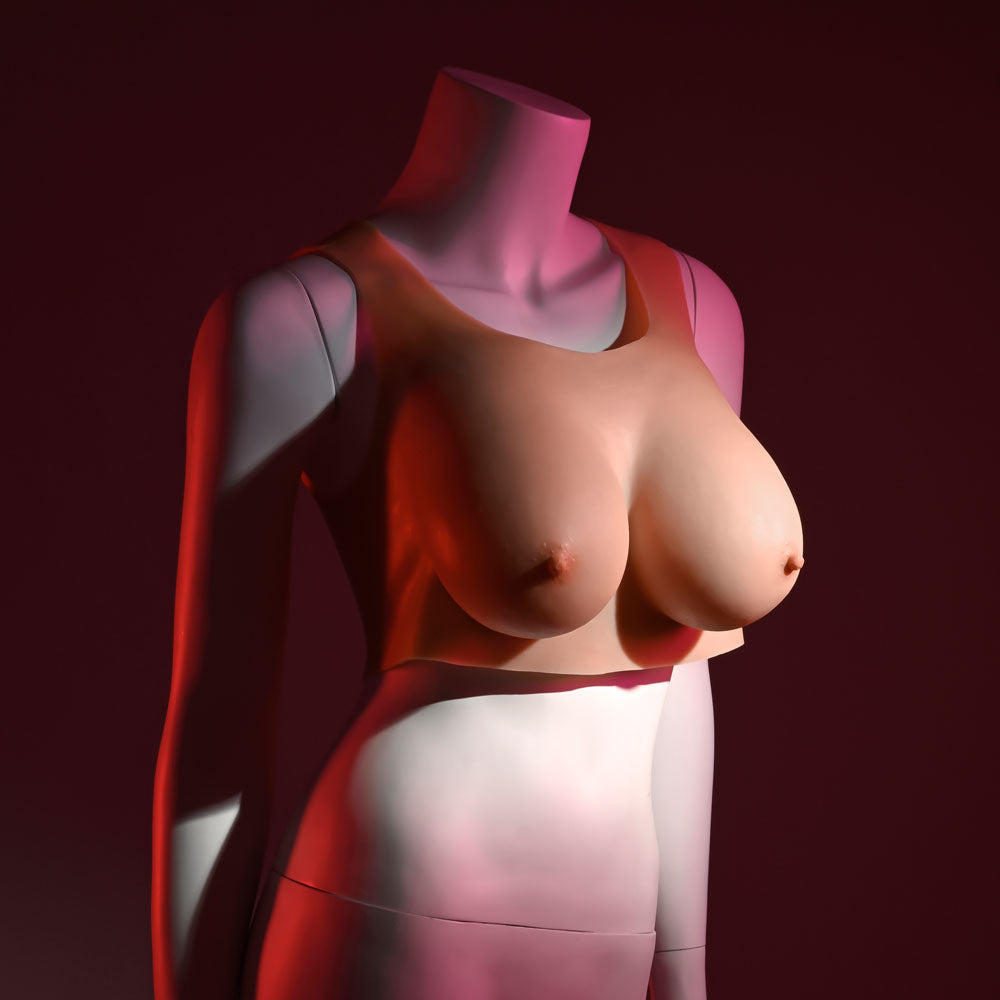 Gender X wearable D-cup breasts displayed on a modern mannequin in a artistic setting.