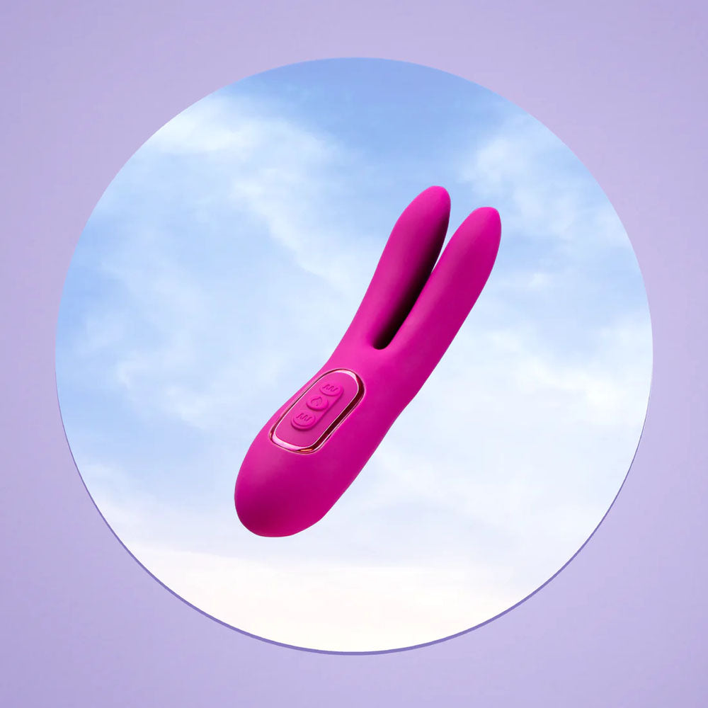 JimmyJane Solis Ascend 2 PRO -  16 cm USB Rechargeable Dual Tip Stimulator in vibrant pink against a serene background.