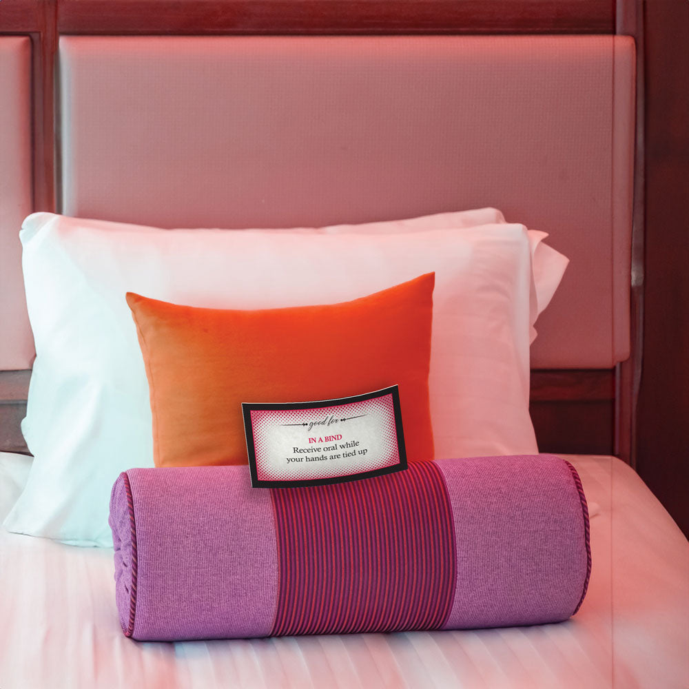 Intimate setup for Oral For Her Sex Coupons - Set of 15 Coupons featuring a purple bolster and colorful pillows.