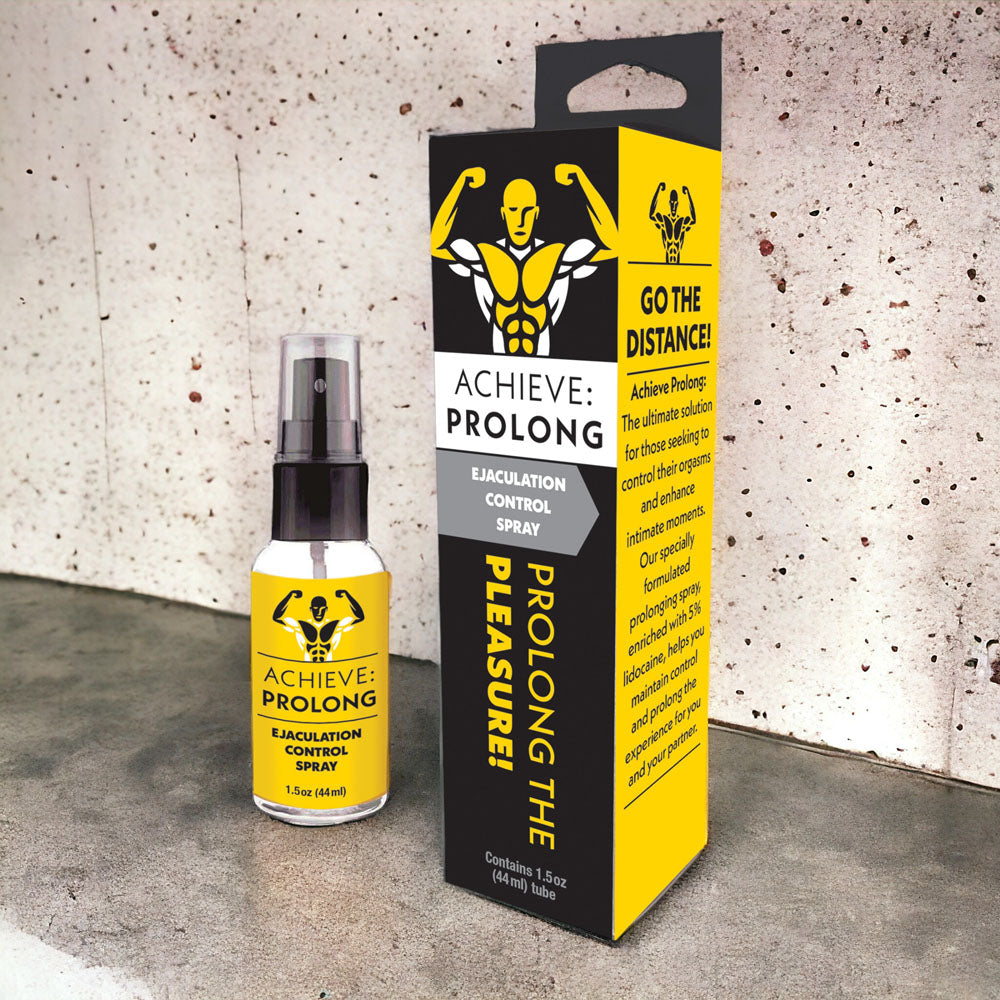 Achieve Prolong ejaculation control spray for men and packaging on a textured background.