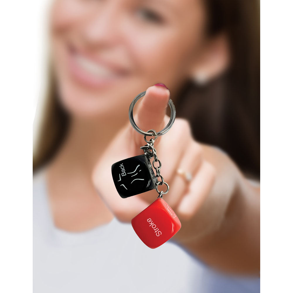 Super Fun Key Chain - Sex Dice - Erotic Dice Novelty Keychain held by a smiling woman, perfect for adding fun to your keyring.