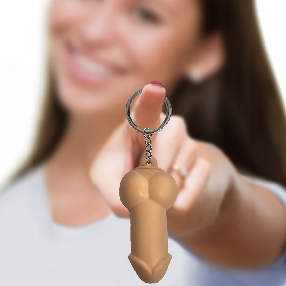 Super Fun Key Chain - Squishy Penis - Novelty Keychain held joyfully by a smiling woman, adding humor to her keyring.