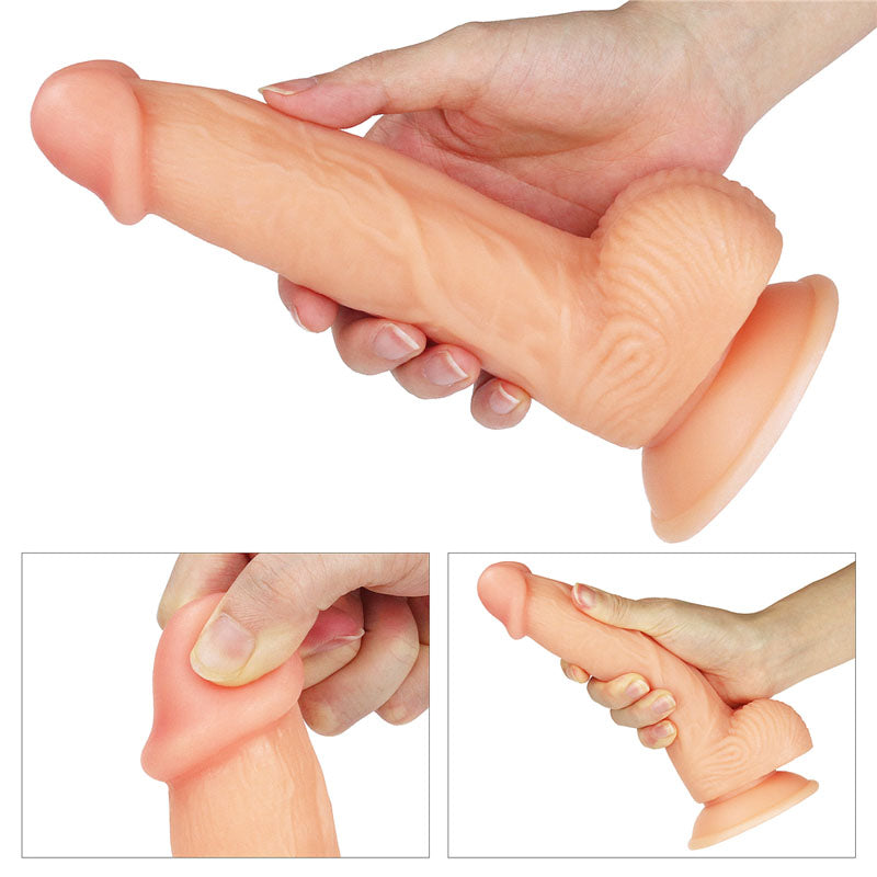 The Ultra Soft Dude -  20.3 cm (8'') Dong held in hand showcasing its realistic texture and design.