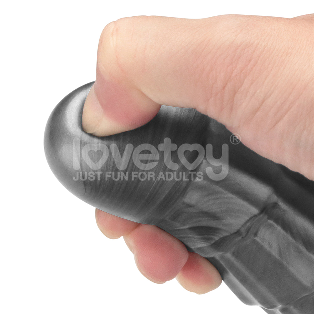 King Sized Vibrating Vibrax Slider - Grey 36.8 cm (14.5'') USB Rechargeable Vibrating Dildo held in hand.