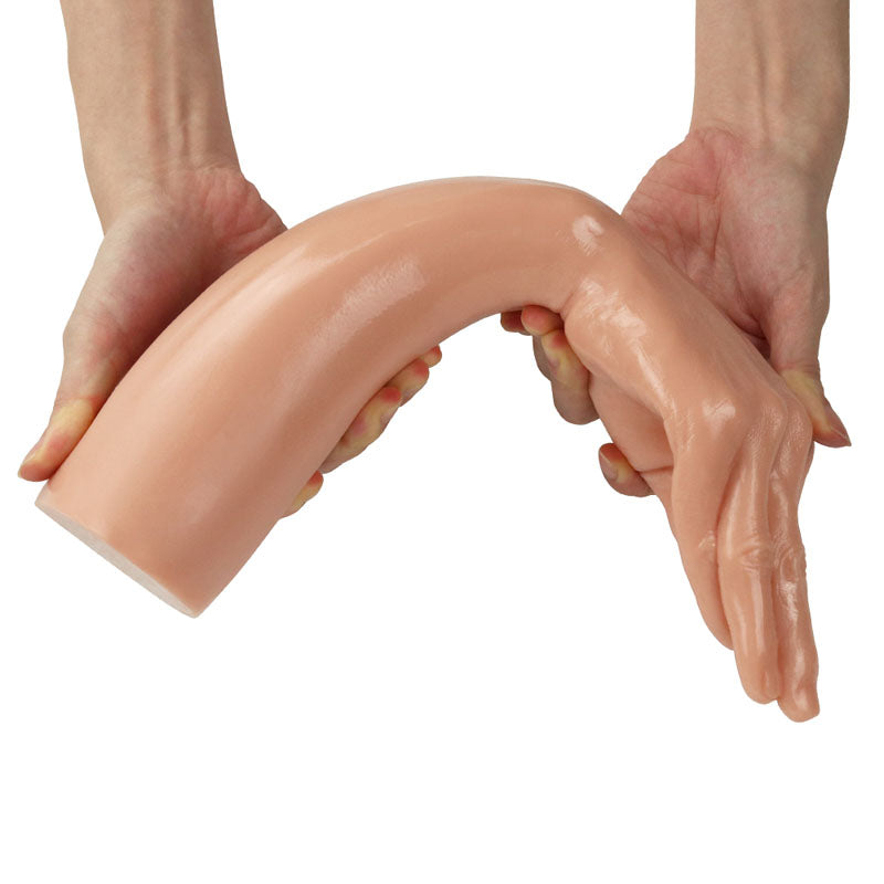 King Sized 13.5'' Realistic Magic Hand - 36 cm Hand Dildo held in hands, showcasing its realistic design and flexible shape.