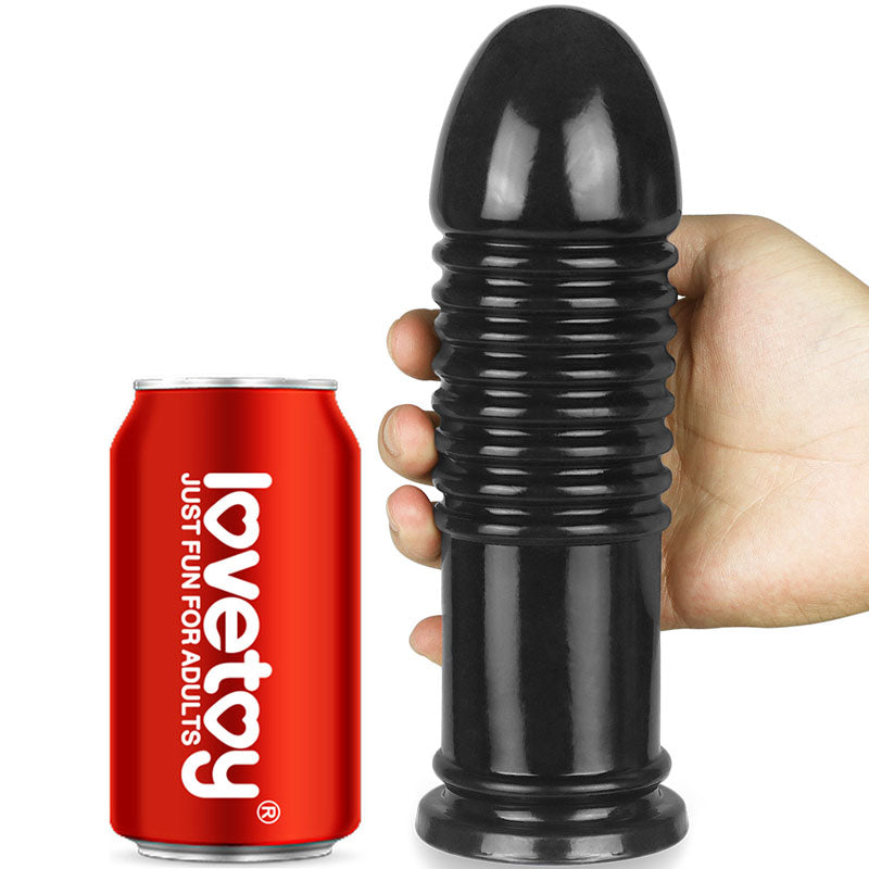 King Sized 8'' Anal Bumper -  22.5 cm Mega Butt Plug next to a soda can for size comparison.