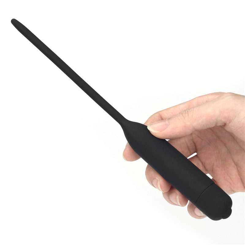Ultimate Silicone Vibrating Urethral Dilator -  Vibrating Urethral Sound held in hand with flexible silicone shaft.