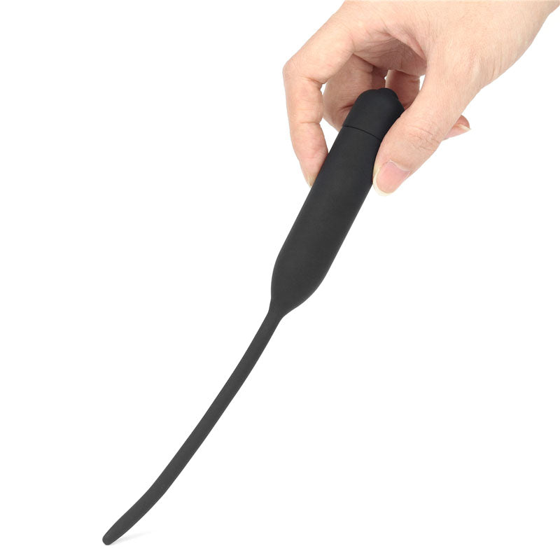Ultimate Silicone Vibrating Urethral Dilator -  Vibrating Urethral Sound held in hand for intimate exploration.