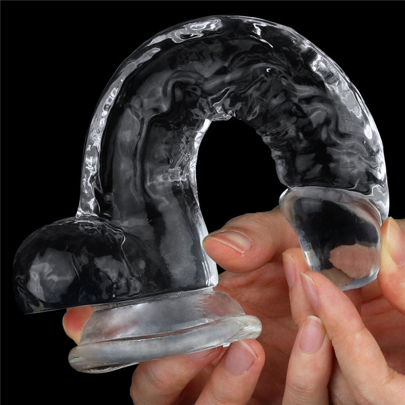 Flawless Dildo 7.5'' - 19 cm Dong held by a hand showcasing its unique curved design and suction cup base for pleasure.