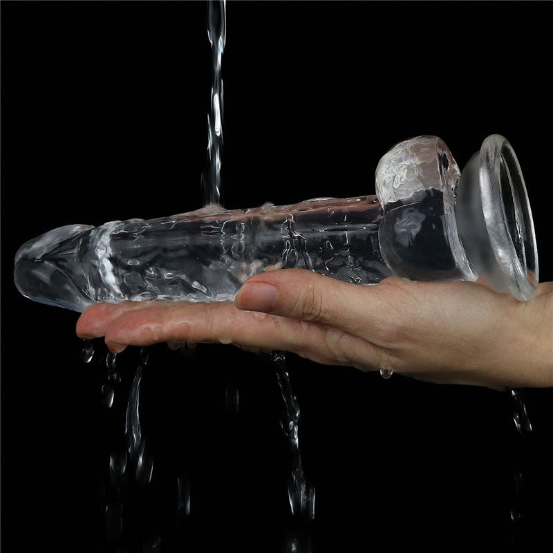Flawless Dildo 7.5'' -  19 cm Dong held in hand with water droplets, designed for intimate essentials.