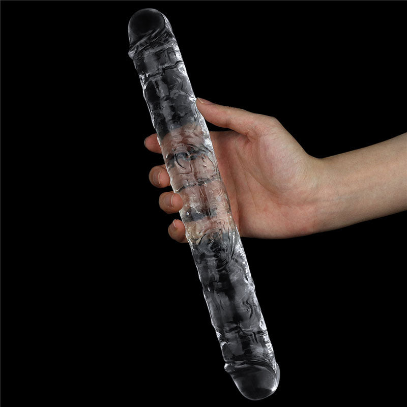 Flawless  Double Dildo 12'' -  30 cm Double Dong being held by a hand, showcasing its transparent design and realistic texture.