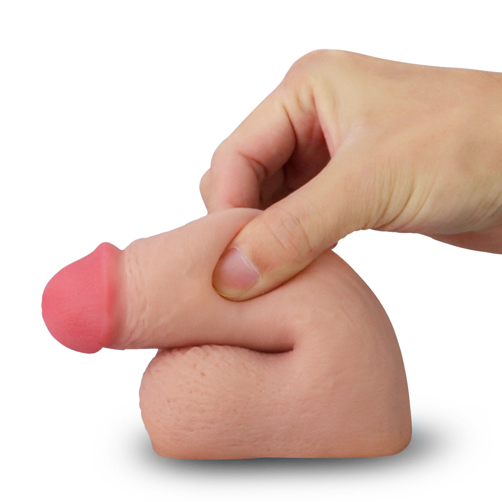 Skinlike Limpy Cock 5'' -  5 Inch Packer being squeezed to demonstrate its lifelike texture for intimate essentials.