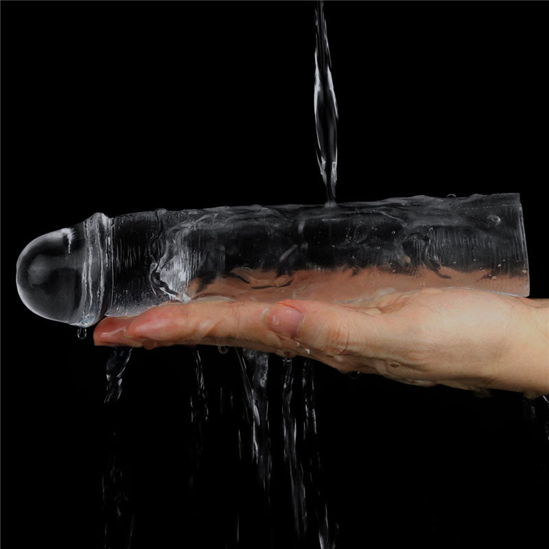 Flawless  Penis Sleeve 2'' -  5 cm Penis Extender Sleeve in hand, showcasing its skin-safe transparent design.
