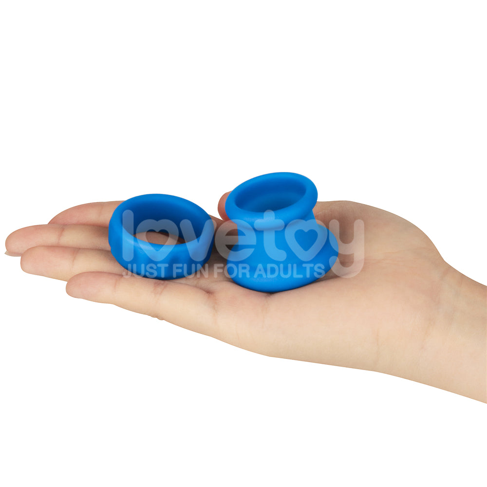 Pinnacle Pro Twin Flex -  Cock & Balls Rings shown in hand, ultra-flexible silicone for customized pleasure.