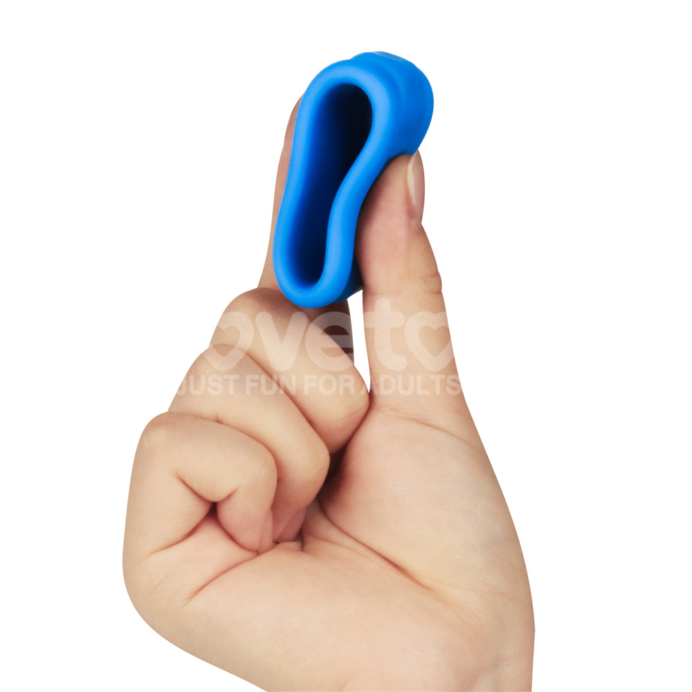 Pinnacle Pro Twin Flex -  Cock & Balls Rings held in a hand, showcasing its flexible silicone design for enhanced pleasure.