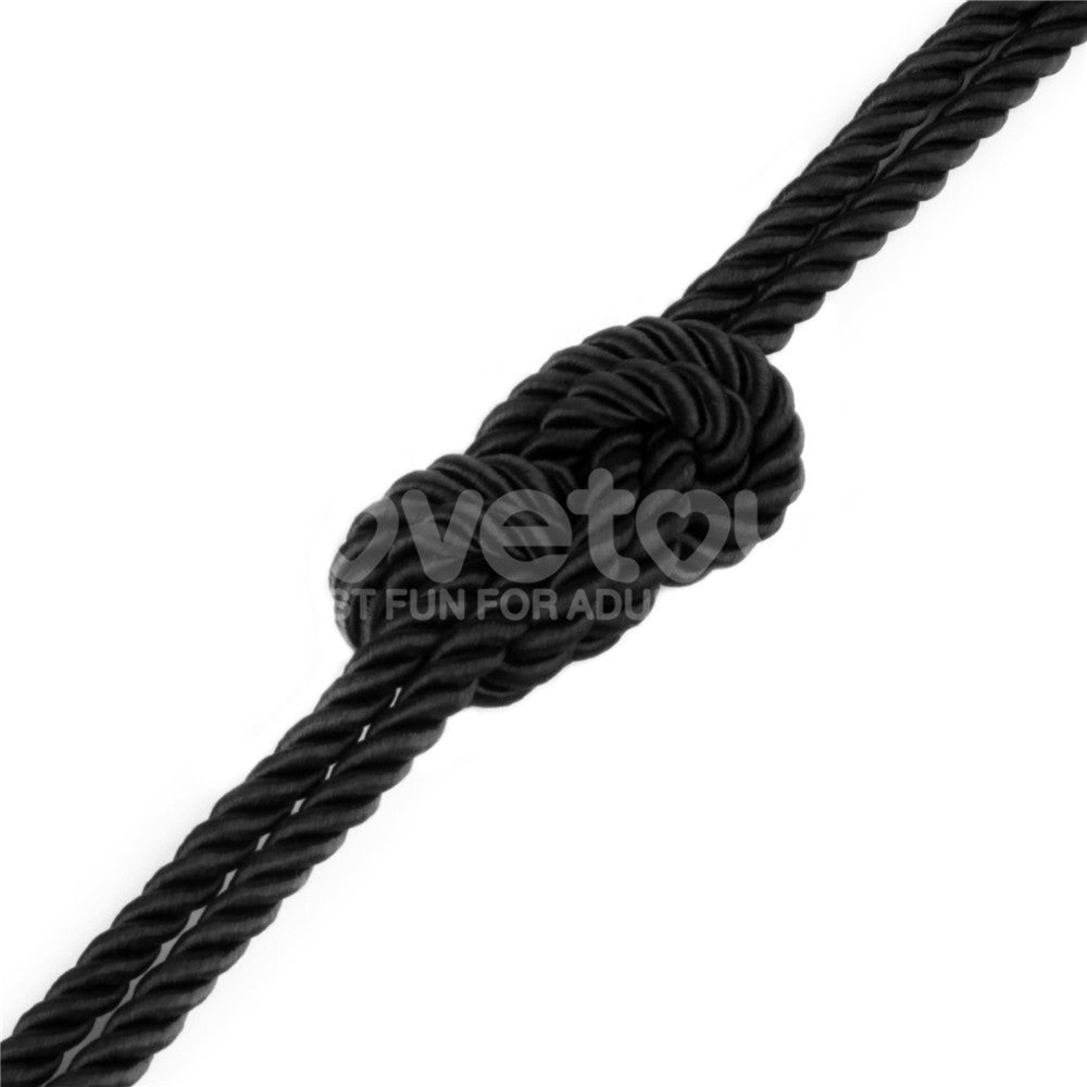 Rebellion Reign Silky Bondage Rope -  -  Bondage Rope - 10 metre length with a close-up of a knot.