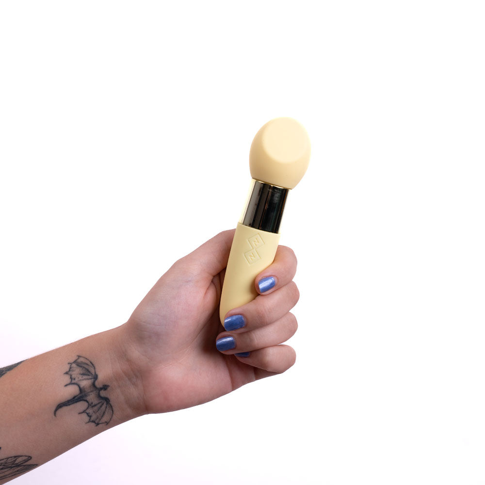 Maia RINA -  -  13.3 cm USB Rechargeable Vibrator in a hand, showcasing its sleek design and usability.