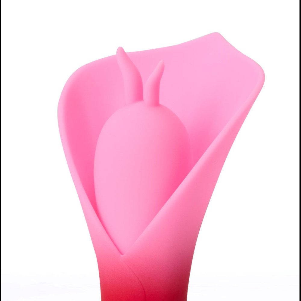 Maia MINA -  - /Pink USB Rechargeable Fluttering Flower Stimulator close-up view showcasing its soft silicone design.