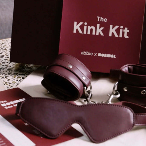abbie x Normal The Kink Kit featuring a silk blindfold and padded cuffs, perfect for a beginner bondage kit.
