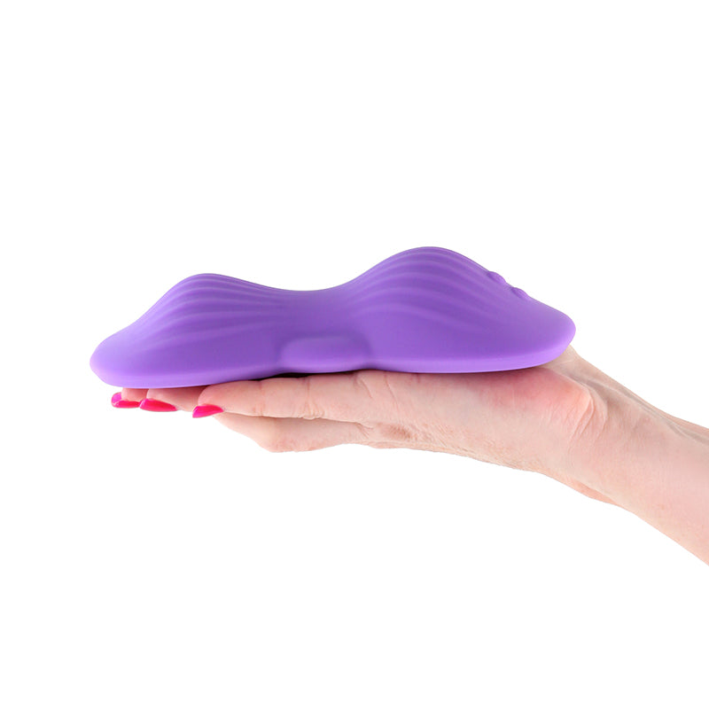 Techno - Trap -  -  USB Rechargeable Vibrating Grind Pad with App Control in hand for intimate essentials.