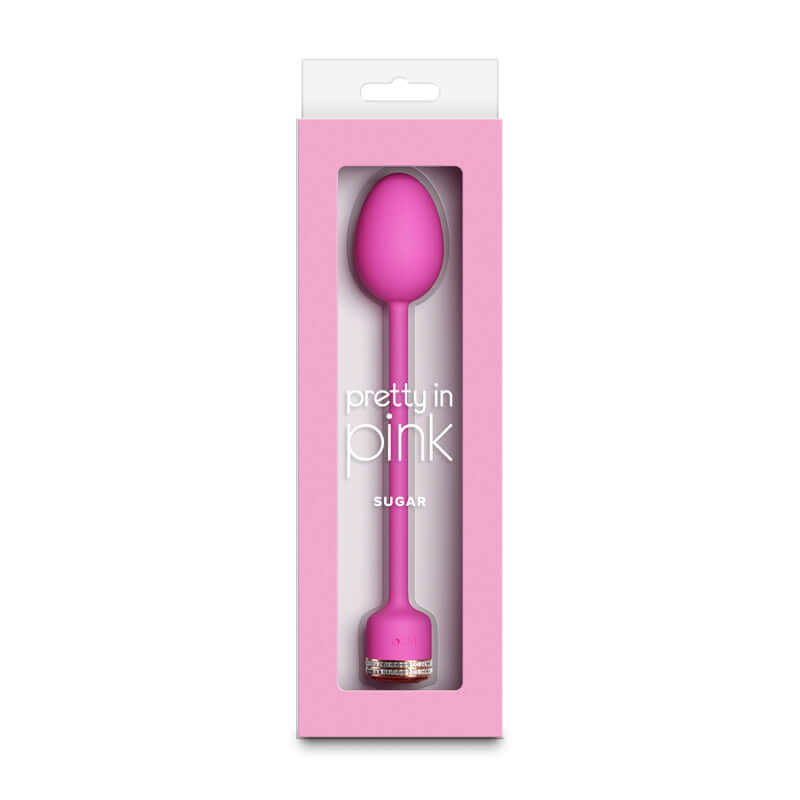 USB rechargeable vibrator by Pretty in Pink, Sugar, in packaging showcasing the sleek design and vibrant color.