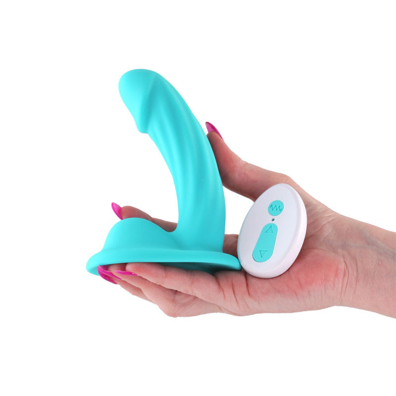 Colours Curve - Vibrating 5'' Dildo - Teal - Teal 12.6 cm USB Rechargeable Vibrating Dildo with Wireless Remote in hand.