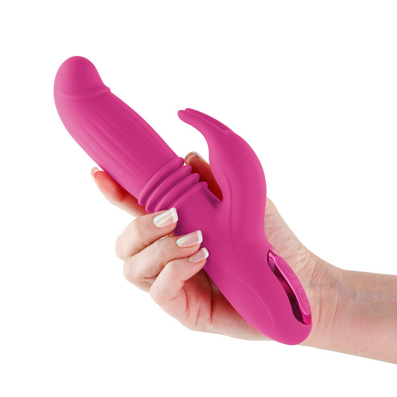INYA Passion -  -  22.2 cm USB Rechargeable Thrusting Rabbit Vibrator in pink held in hand, ideal intimate essentials for her.
