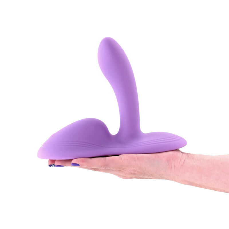 Vibrating grinder pad held in hand, designed for intimate satisfaction and comfort. USB rechargeable for pleasure on demand.